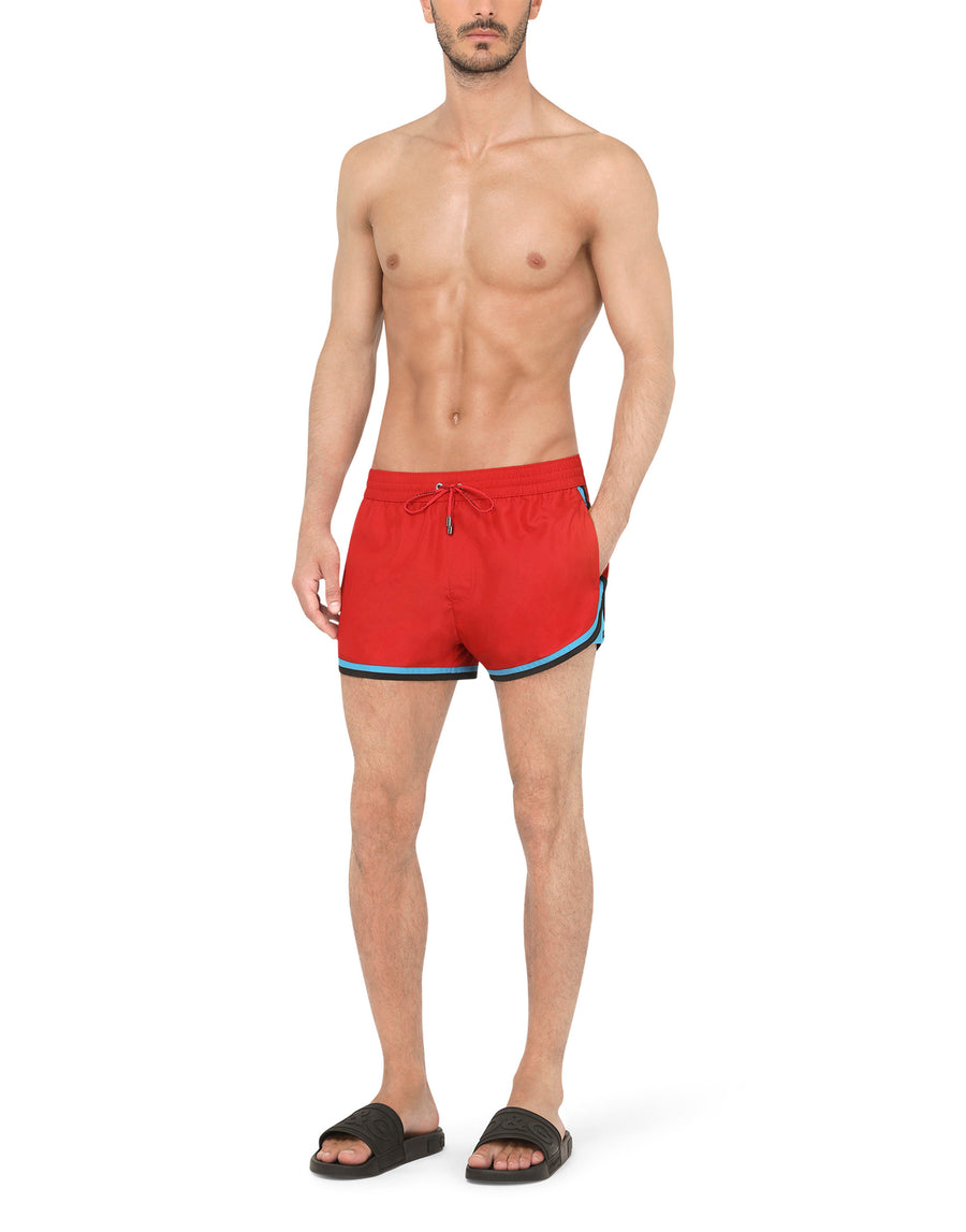 Short swim trunks with contrasting-colored trims