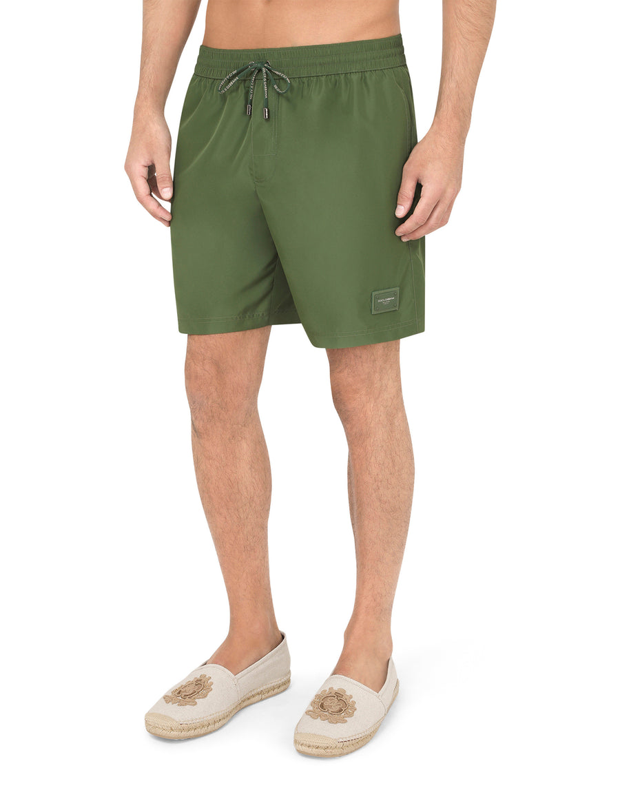 Mid-length swim trunks with branded plate