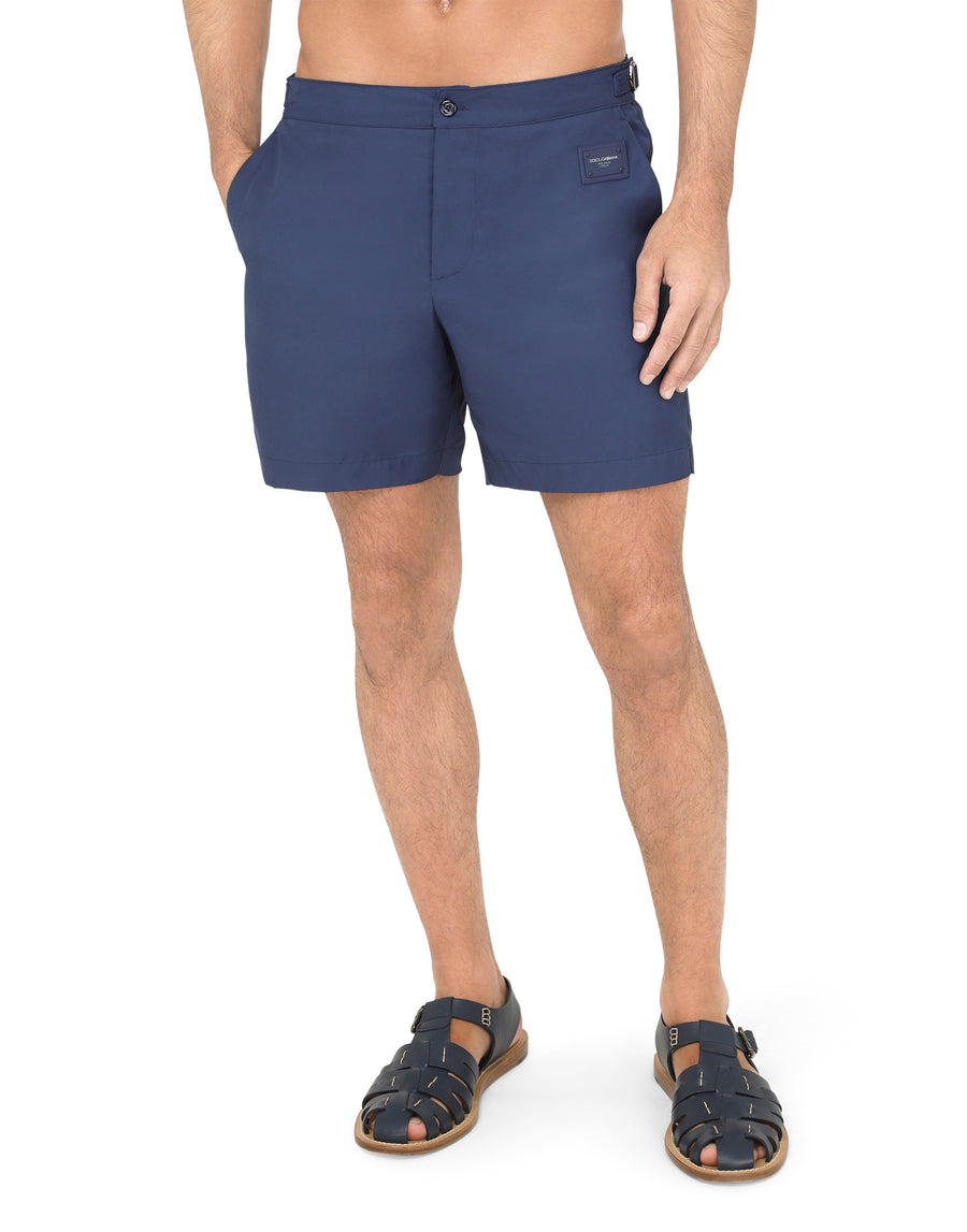 Mid-length swim shorts with branded plate