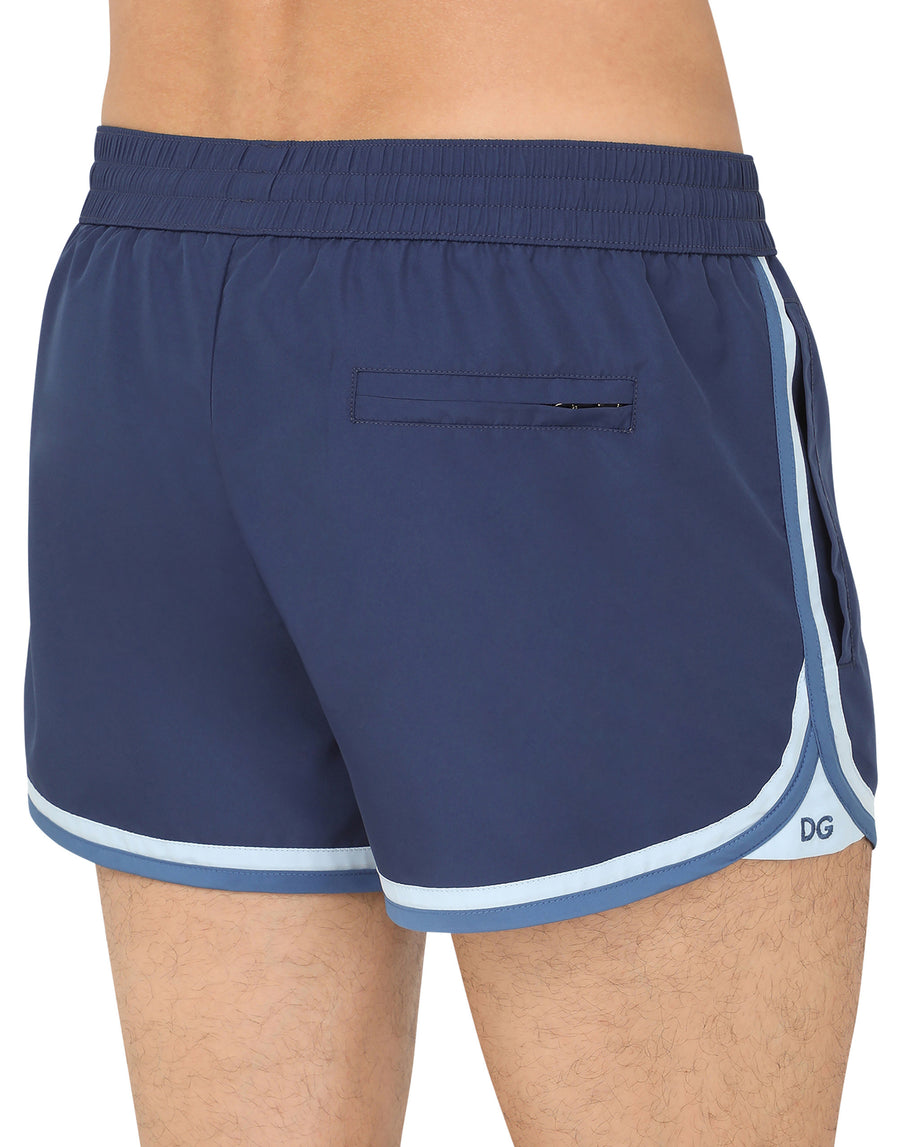 Short swim trunks with contrasting-colored trims