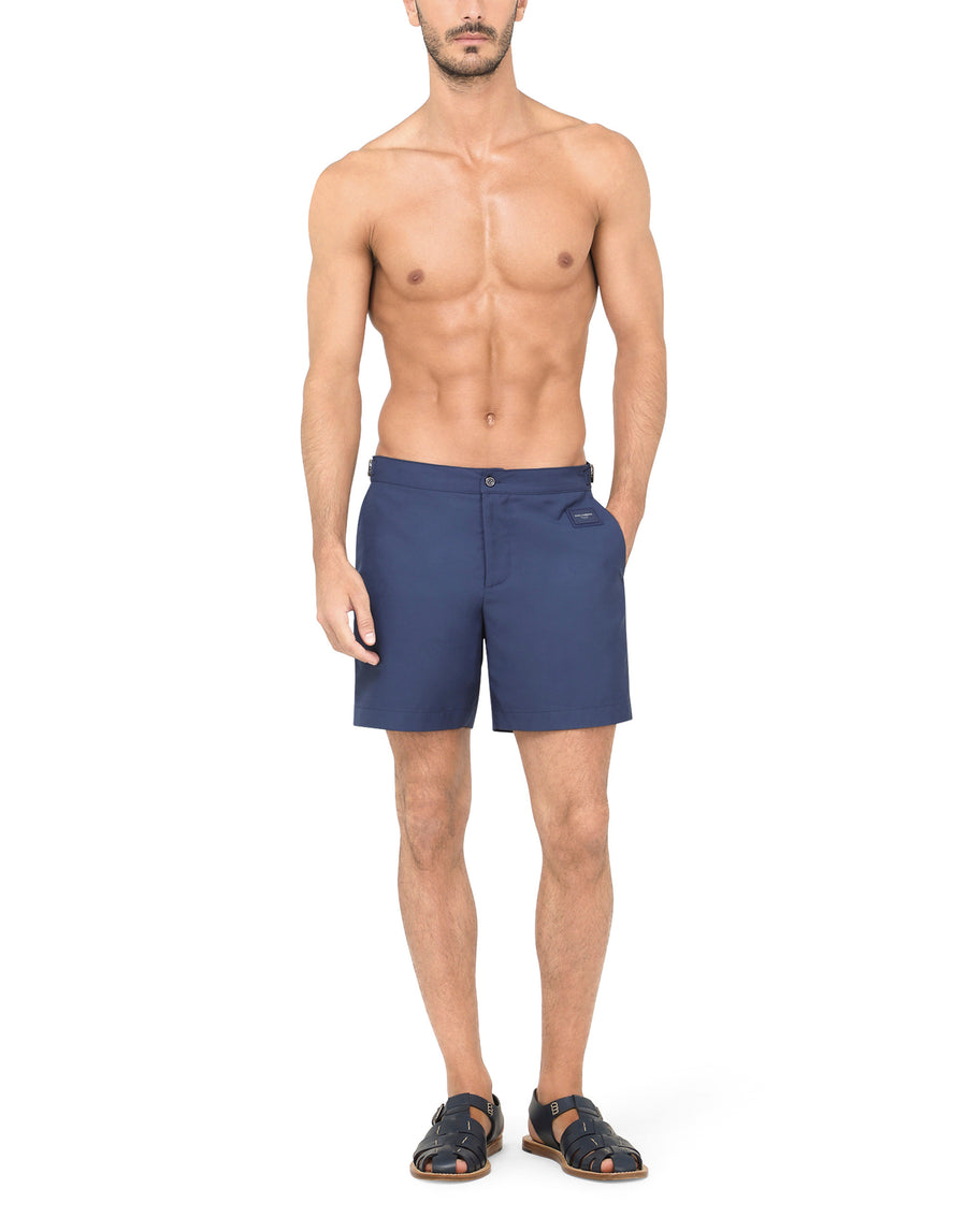 Mid-length swim shorts with branded plate