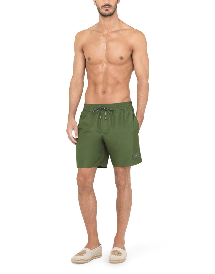 Mid-length swim trunks with branded plate